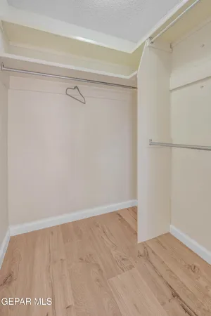 a view of an empty walk in closet