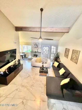 a view of living room with furniture and flat screen tv