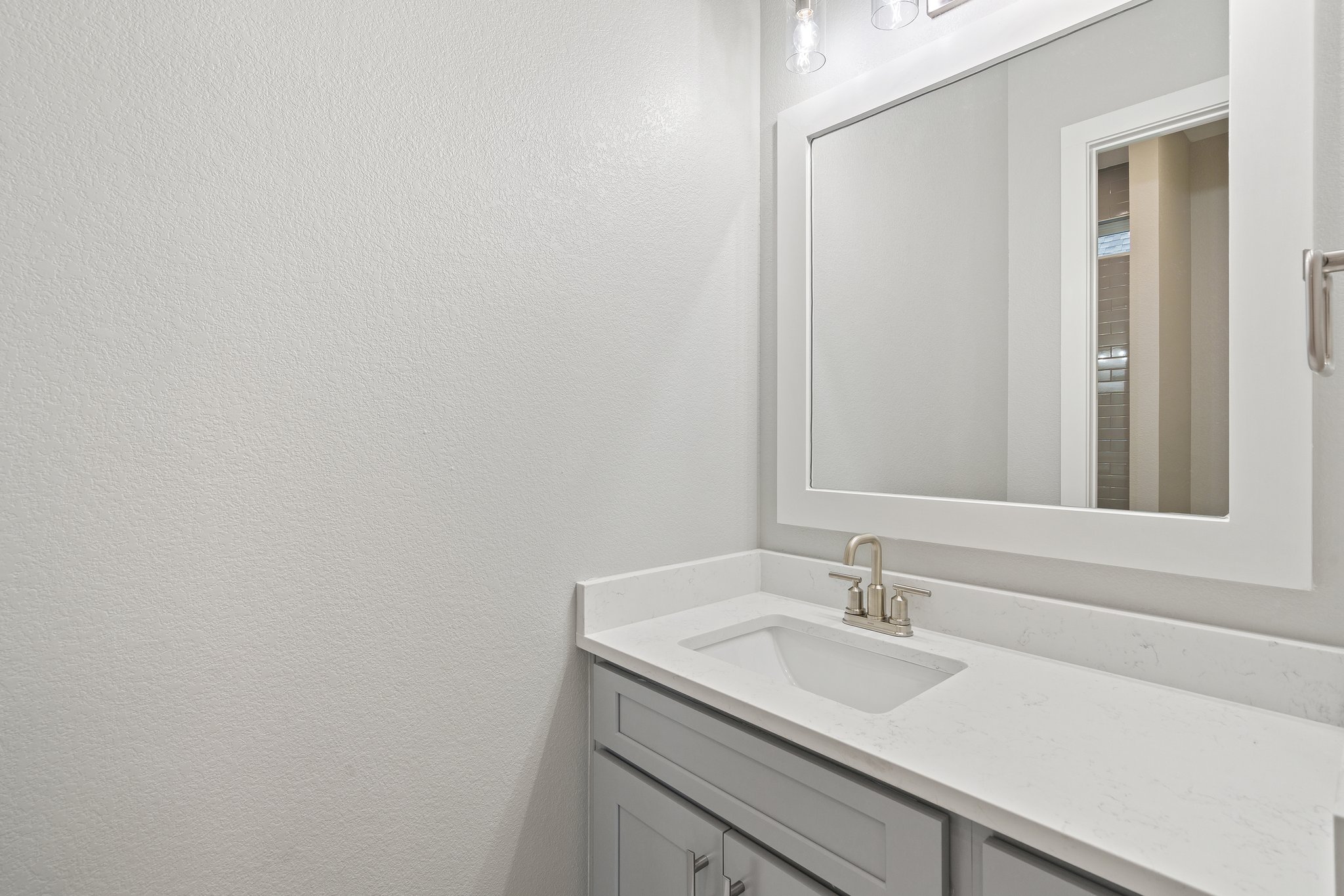 112 Axis Loop Georgetown, TX 78628 - Photo 30 of 39 a bathroom with a sink and a mirror
