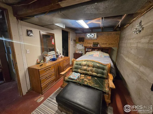 a bedroom with furniture and window