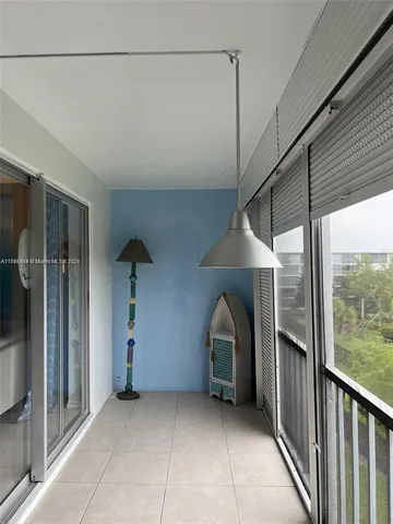 a view of a house with a porch and furniture