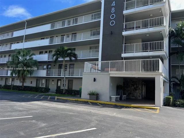a front view of a building with a street