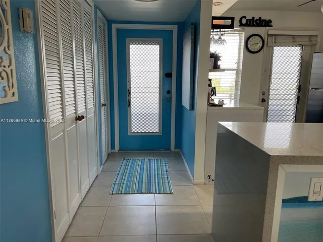 a view of a kitchen cabinets and entryway