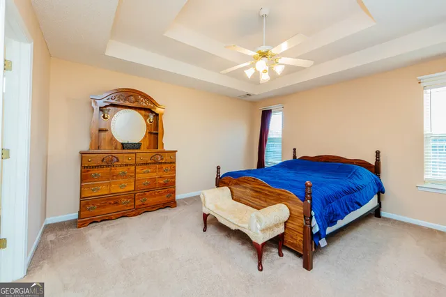 a bedroom with a bed and closet