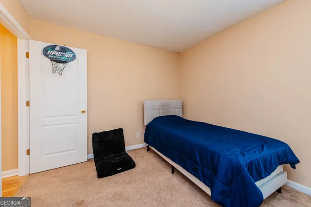 a room with a bed and cabinets