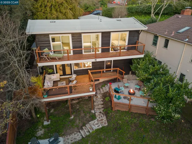 aerial view of a house with swimming pool and sitting area