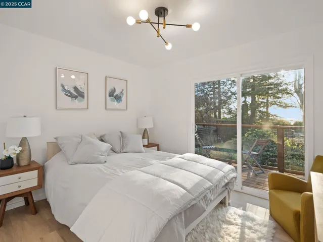 a bedroom with a large bed and a couch