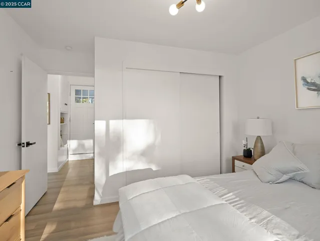 a bedroom with a bed and a walk in closet
