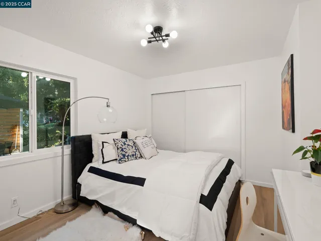 a bedroom with a bed and a table in it