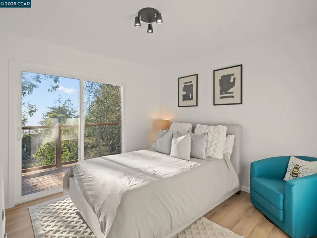 a bedroom with a large bed and a couch