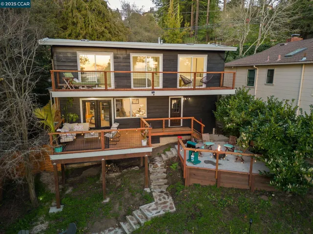 a house with lots of trees in the background