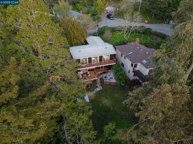 an aerial view of a house with a garden