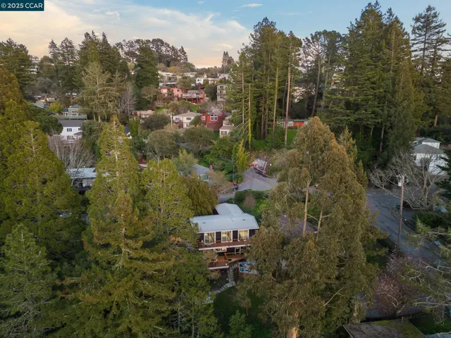 a aerial view of a house with a yard