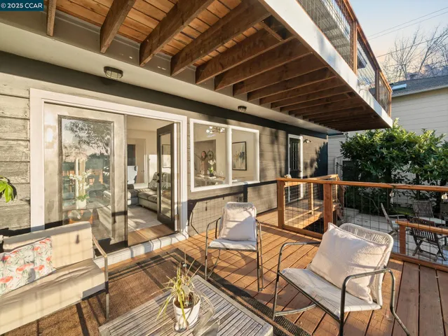 a view of a patio with wooden floor