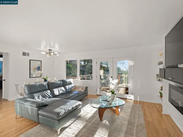 a living room with furniture fireplace and a flat screen tv