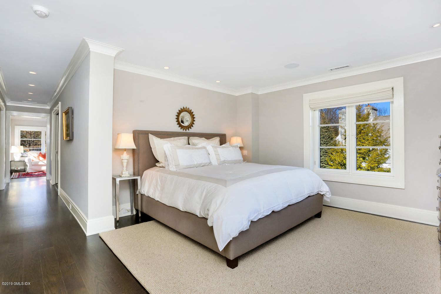 56 Old Church Road Greenwich, CT 06830 - Photo 15 of 41 a bed room with a bed and a large window