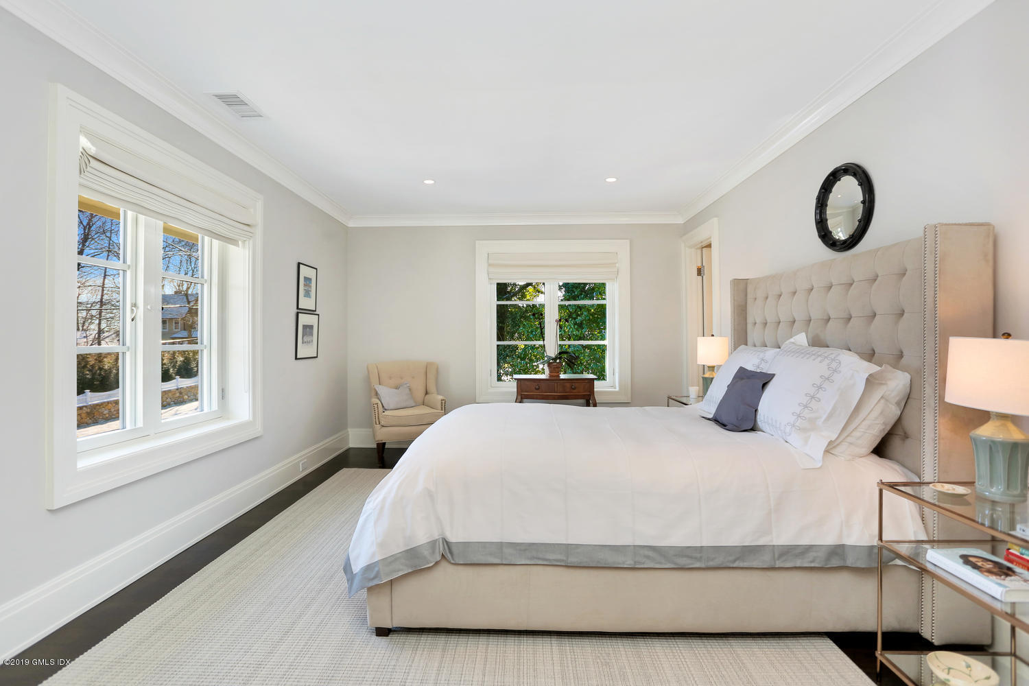 56 Old Church Road Greenwich, CT 06830 - Photo 19 of 41 a bedroom with a large bed and a window