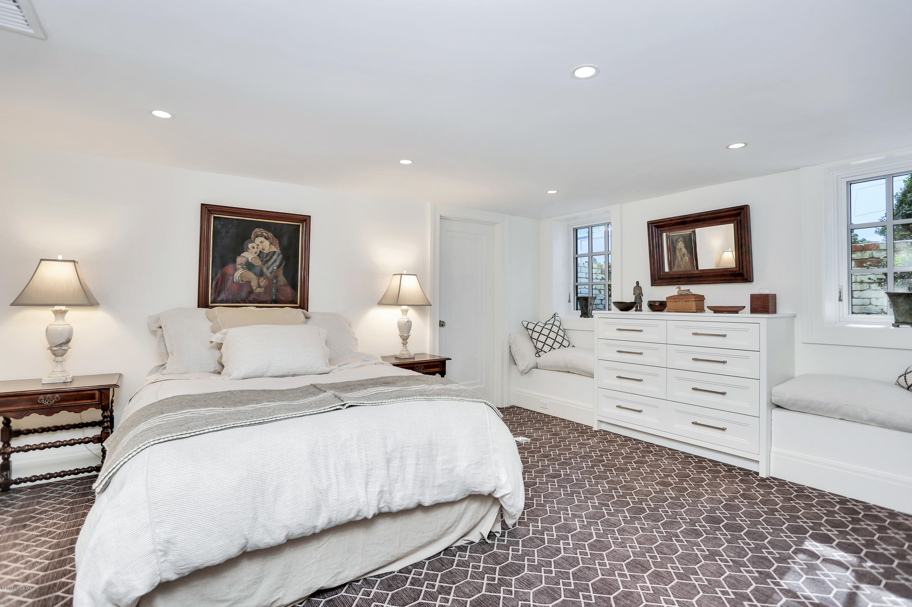 56 Old Church Road Greenwich, CT 06830 - Photo 25 of 41 a bedroom with a bed and wooden floor
