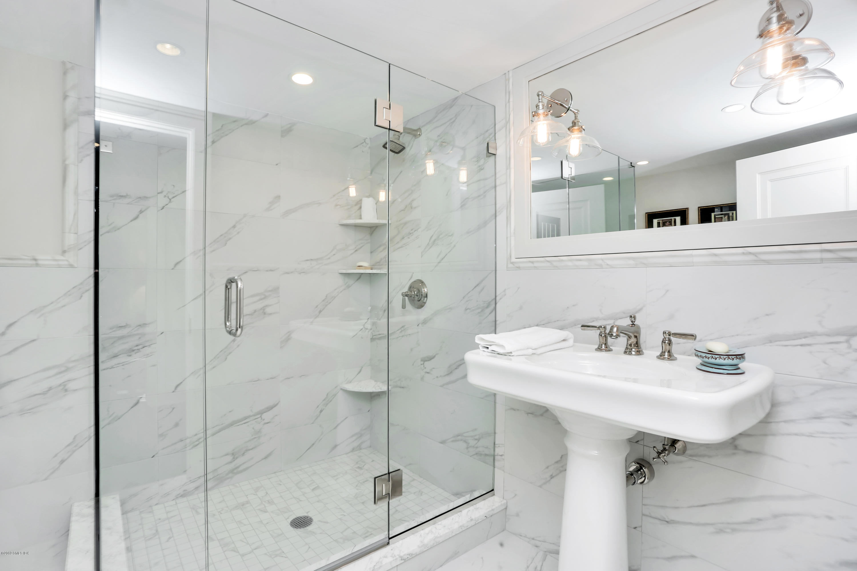 56 Old Church Road Greenwich, CT 06830 - Photo 26 of 41 a bathroom with a sink mirror and shower