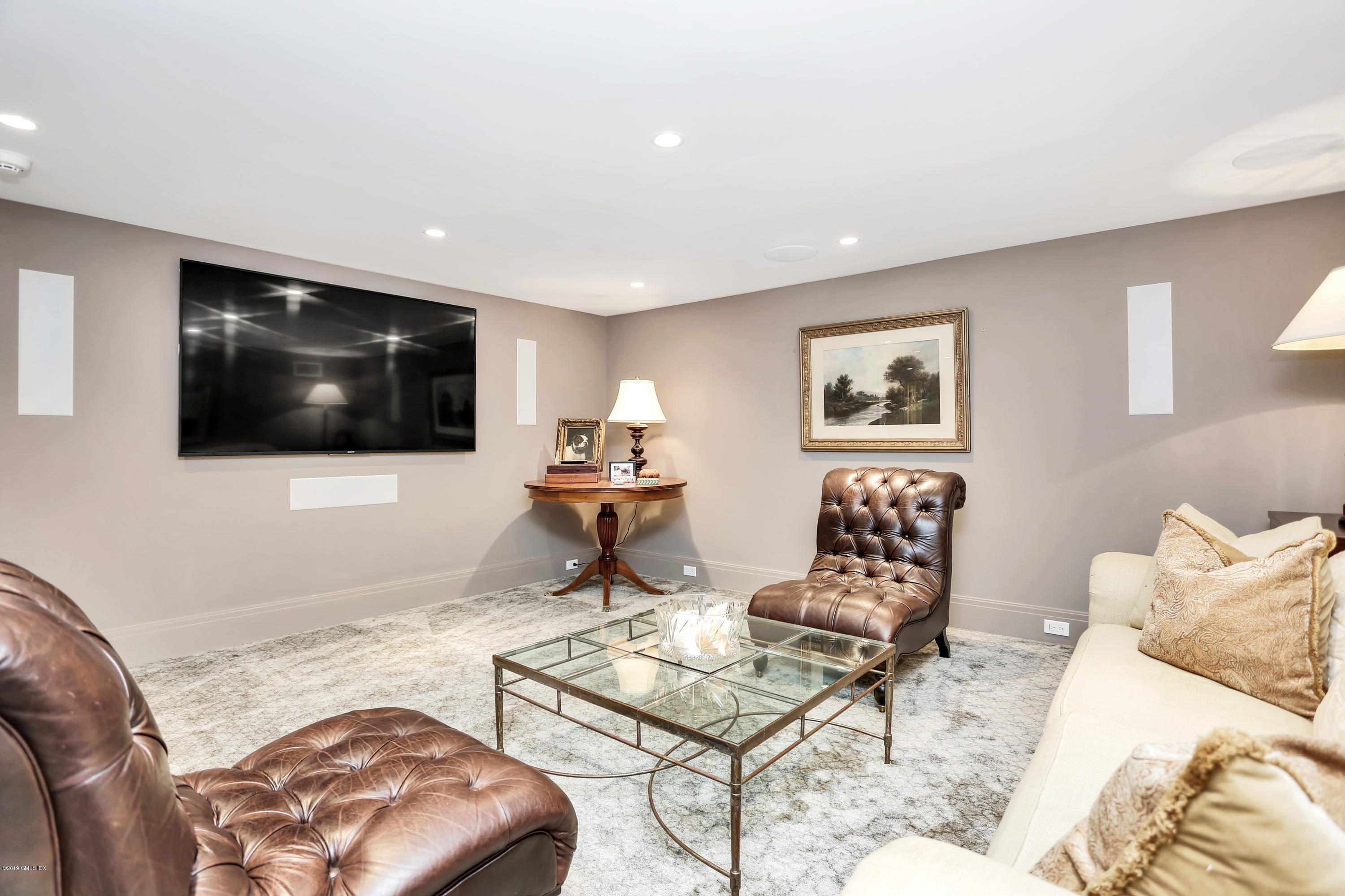 56 Old Church Road Greenwich, CT 06830 - Photo 28 of 41 a living room with furniture and a flat screen tv