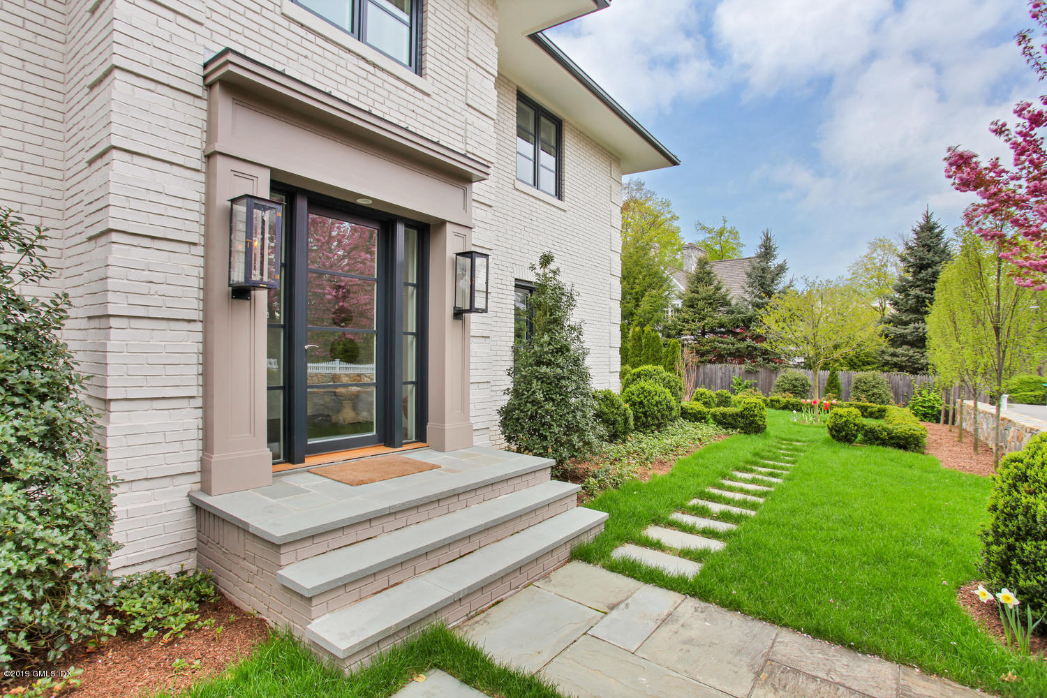 56 Old Church Road Greenwich, CT 06830 - Photo 3 of 41 a view of a bench in front of house