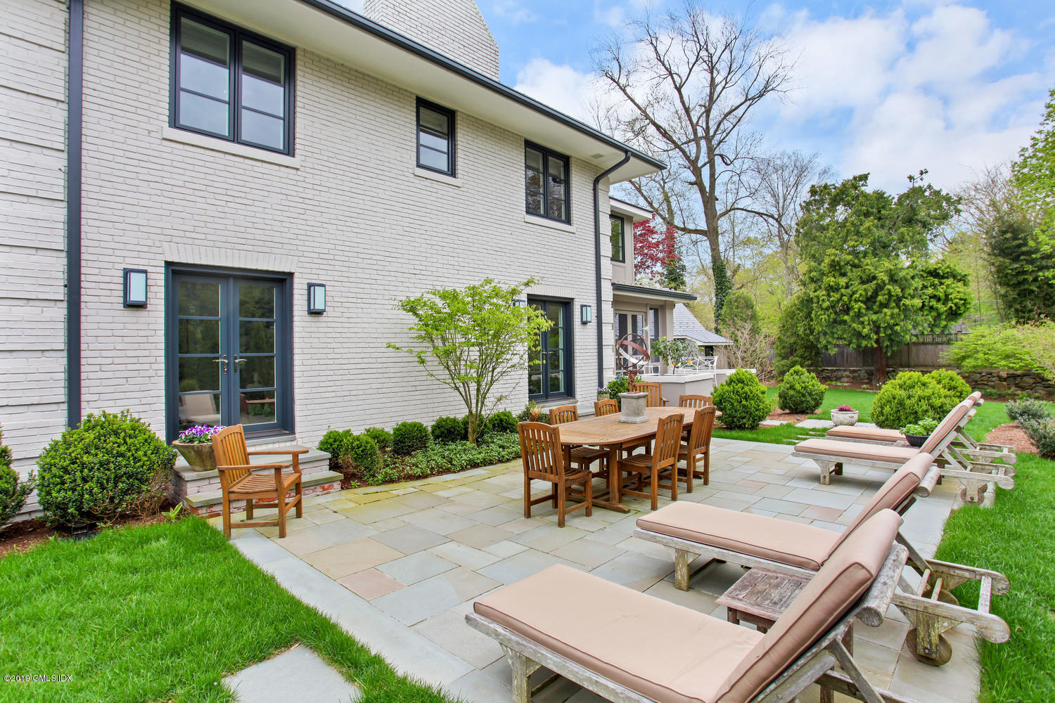 56 Old Church Road Greenwich, CT 06830 - Photo 31 of 41 a view of a backyard with sitting area