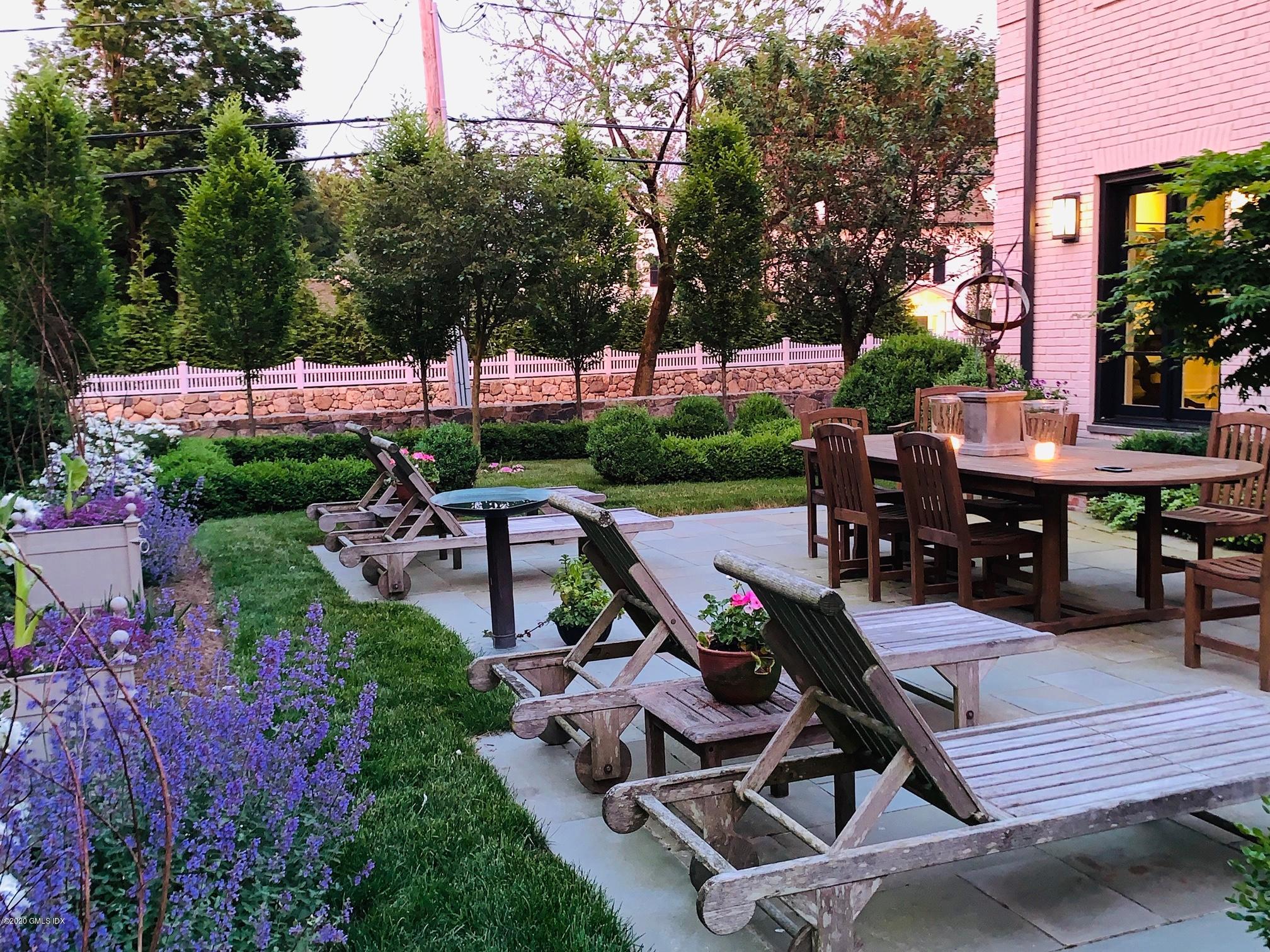 56 Old Church Road Greenwich, CT 06830 - Photo 34 of 41 a view of a backyard with sitting area