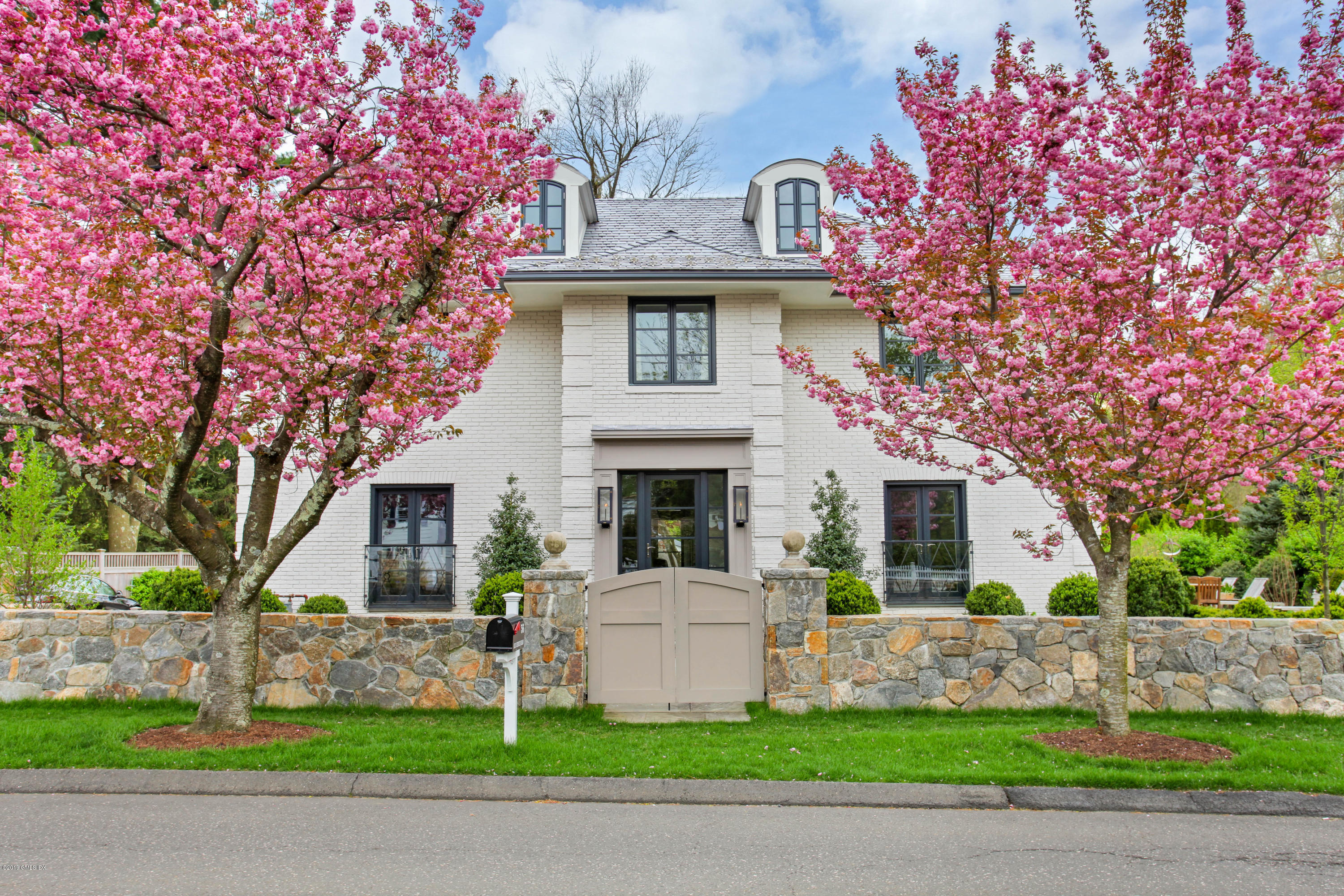 56 Old Church Road Greenwich, CT 06830 - Photo 41 of 41 a front view of a house with garden