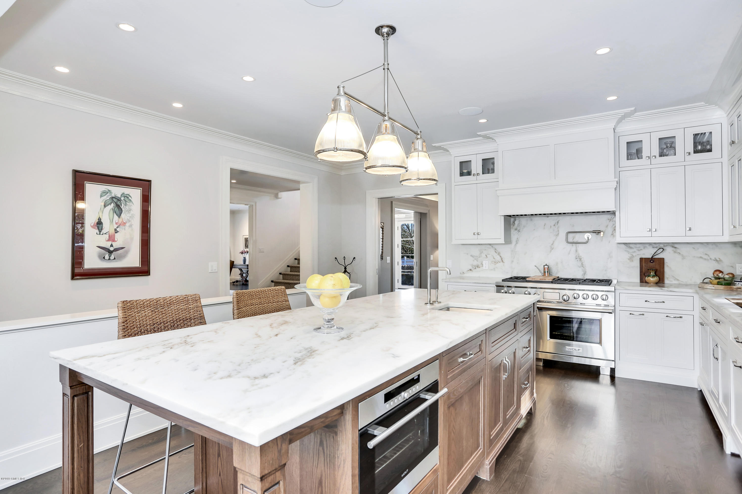 56 Old Church Road Greenwich, CT 06830 - Photo 10 of 41 a kitchen with kitchen island a stove a sink a center island and cabinets