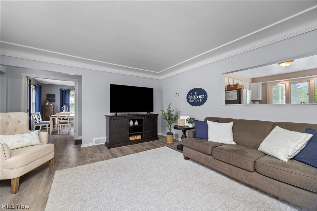 11492 Ridge Road North Royalton, OH 44133 - Photo 11 of 32 Spacious living area featuring wood-finish flooring, light gray wall tones, and white trim
