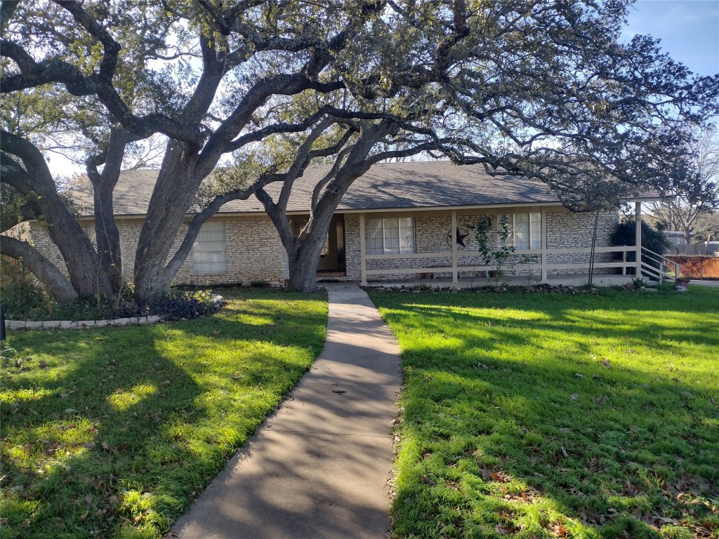 205 Shady Oak Drive Georgetown, TX 78628 - Photo 1 of 13 a view of a house with a yard deck and a large tree