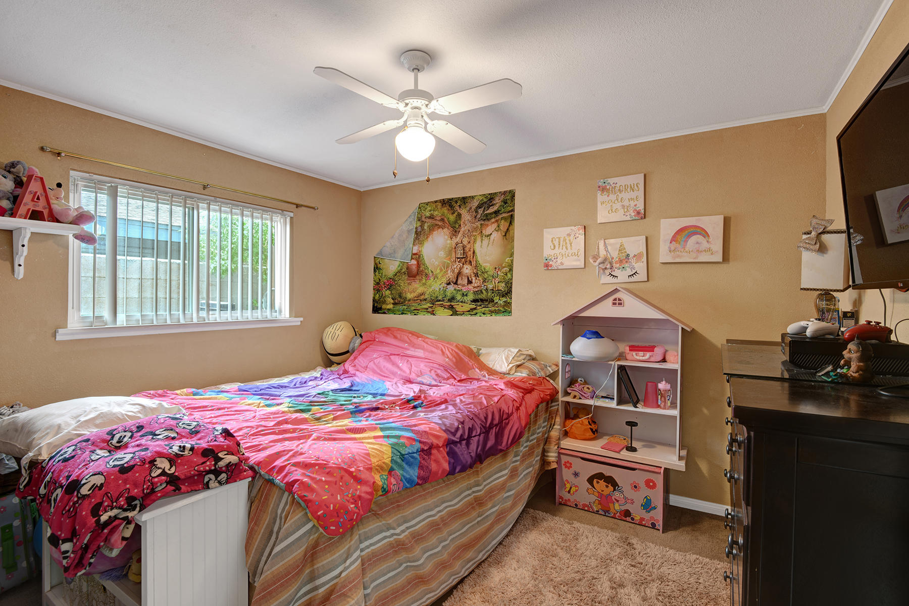 81850 Victoria Street Indio, CA 92201 - Photo 11 of 17 a bedroom with a bed and a flat screen tv