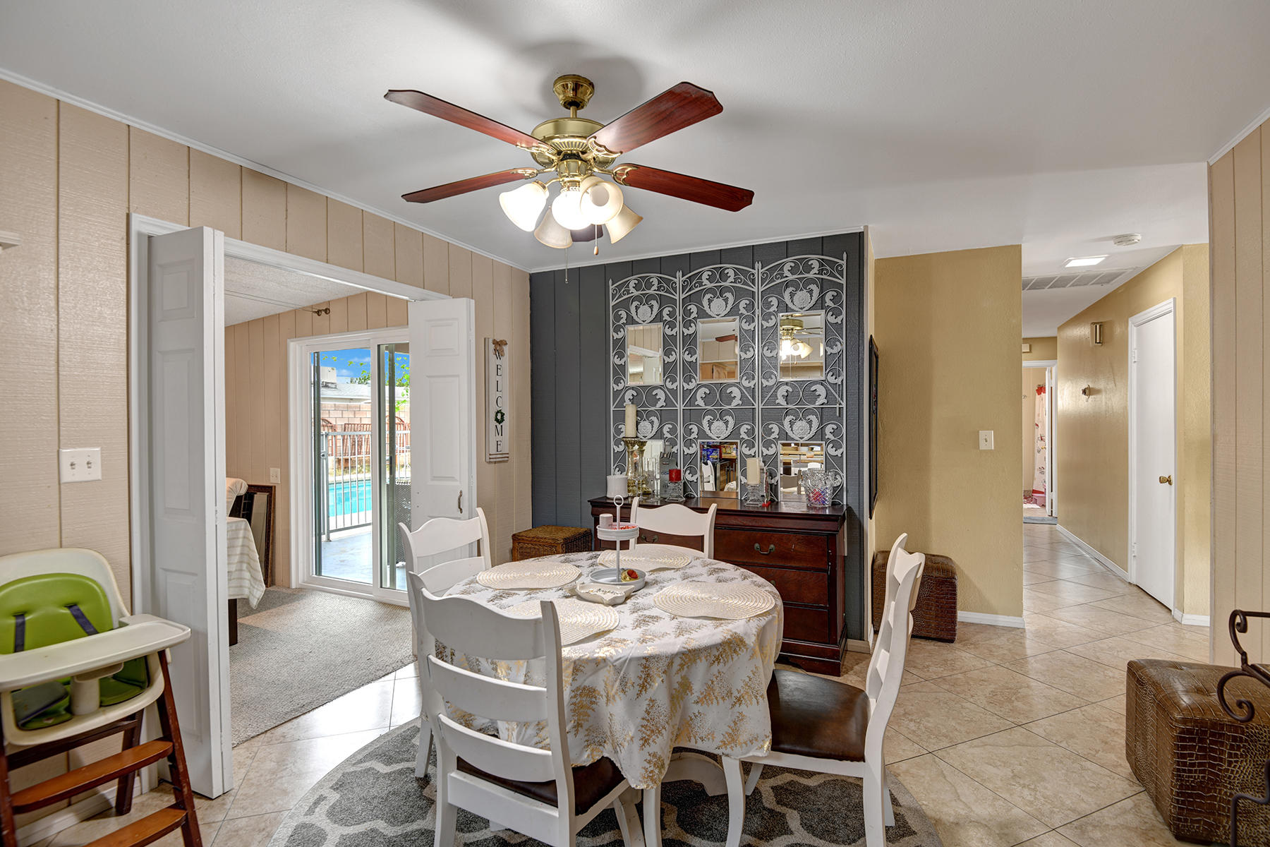 81850 Victoria Street Indio, CA 92201 - Photo 13 of 17 a view of a dining room with furniture window and wooden floor