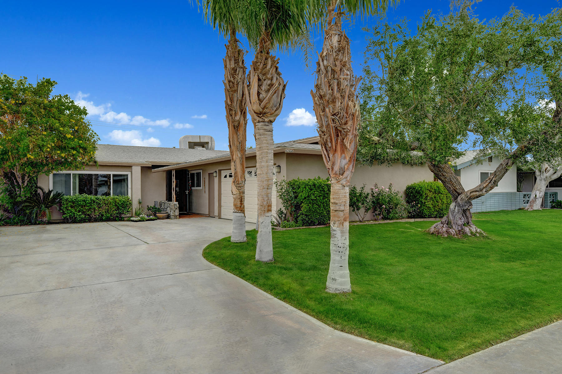 81850 Victoria Street Indio, CA 92201 - Photo 2 of 17 a view of a house with a yard