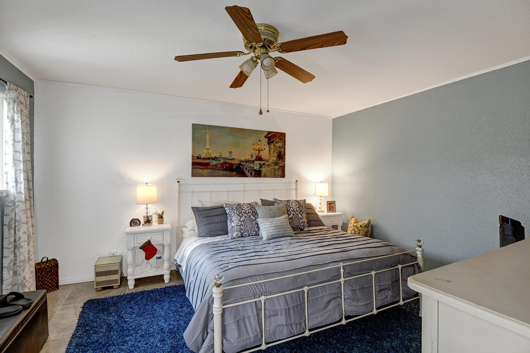 81850 Victoria Street Indio, CA 92201 - Photo 6 of 17 a bedroom with a bed and a chandelier