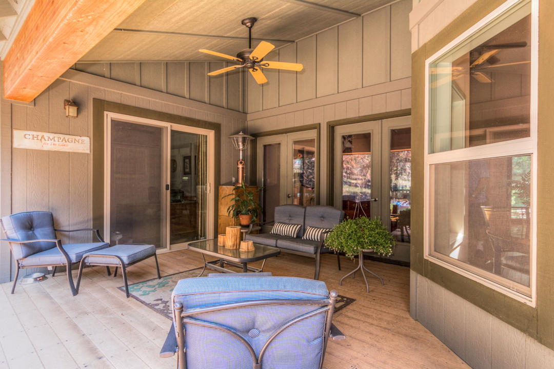 17065 Azusa Road Bend, OR 97707 - Photo 10 of 37 The Great Room spills out onto the rear deck, which has a partially covered seating area.