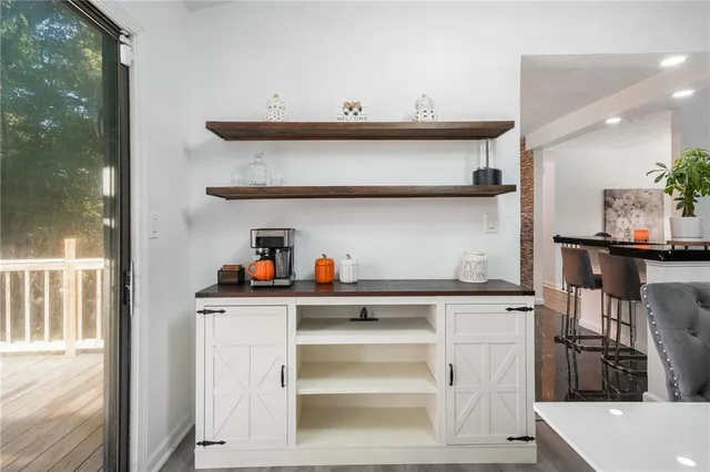 a kitchen with stainless steel appliances a sink and cabinets