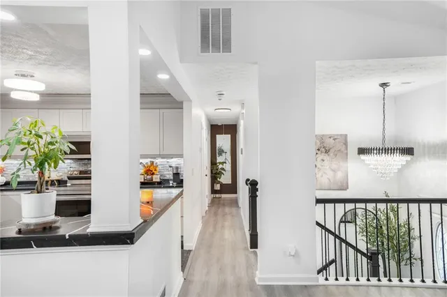 a view of a hallway with dining area