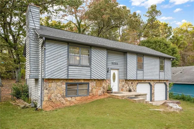 a front view of a house with garage