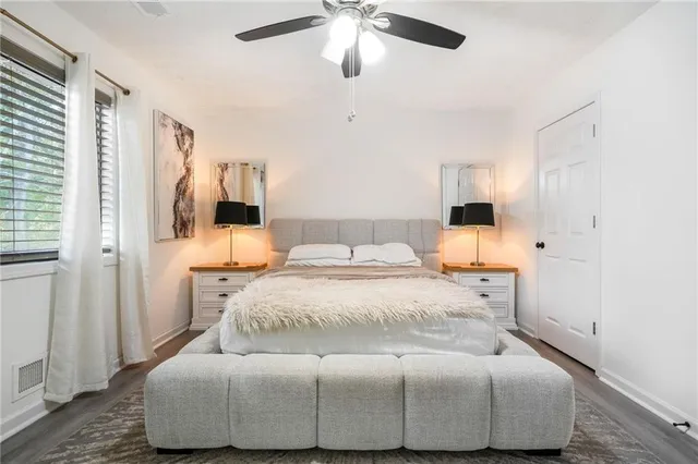 a bedroom with a bed and closet