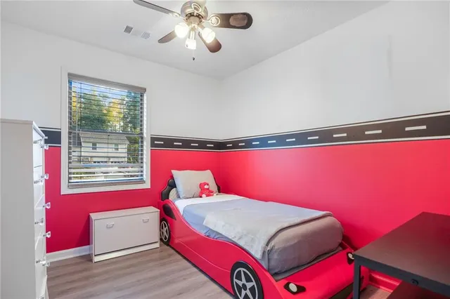 a bedroom with a bed and window