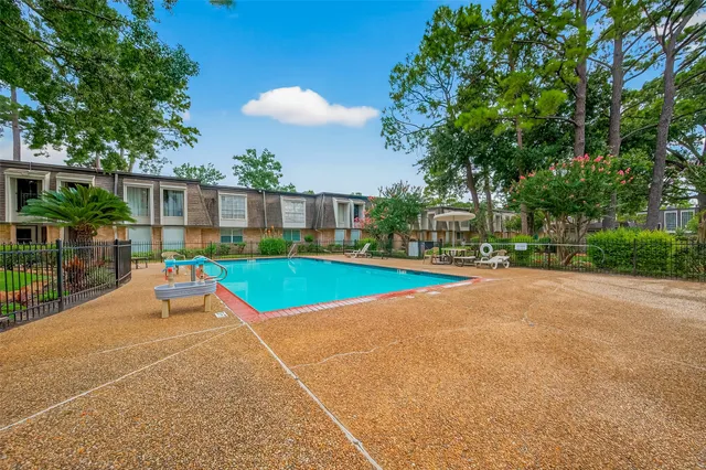 a view of outdoor space with swimming pool and patio