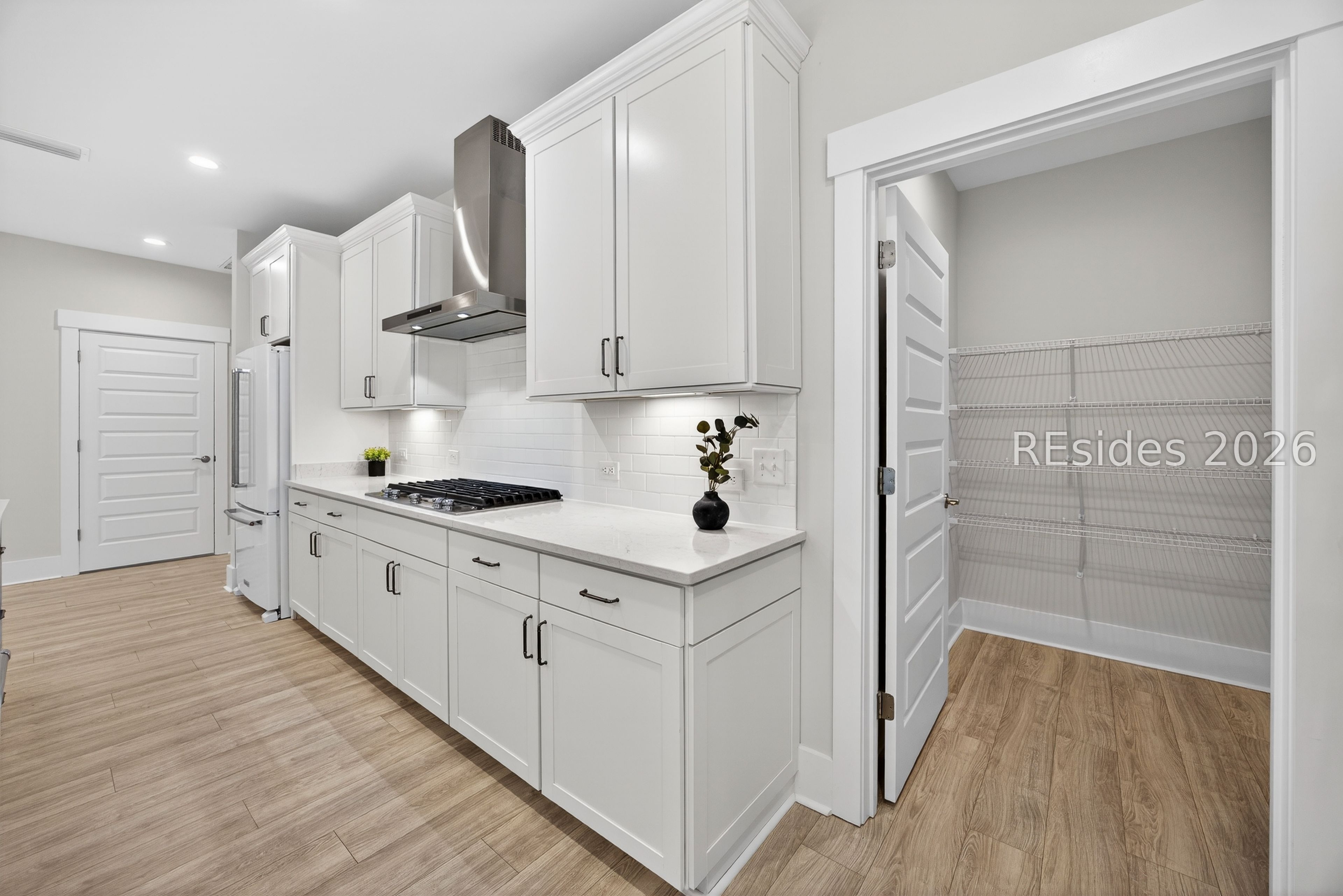 539 Sunfish Way Bluffton, SC 29909 - Photo 23 of 71 Gas Stove with hood vent & pantry view