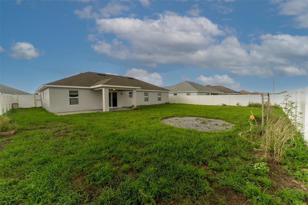 5050 Southwest 91st Place Ocala, FL 34476 - Photo 29 of 33 a view of a house with a backyard