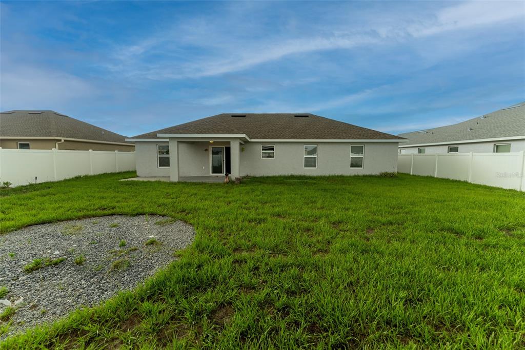 5050 Southwest 91st Place Ocala, FL 34476 - Photo 30 of 33 a front view of a house with a garden