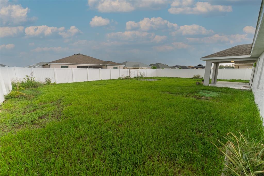 5050 Southwest 91st Place Ocala, FL 34476 - Photo 31 of 33 a view of house with yard and entertaining space