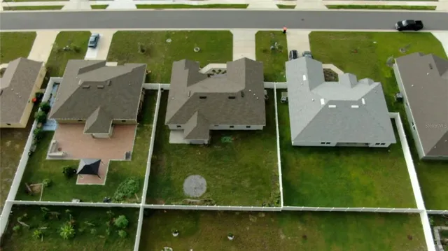 an aerial view of a house with a swimming pool