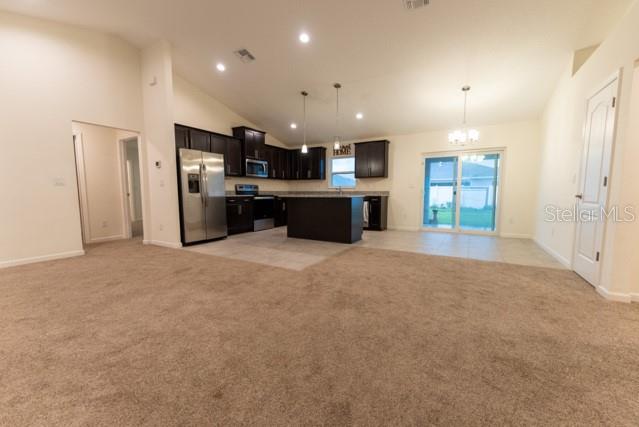 5050 Southwest 91st Place Ocala, FL 34476 - Photo 4 of 33 a large kitchen with a refrigerator and a sink
