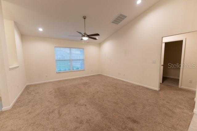 5050 Southwest 91st Place Ocala, FL 34476 - Photo 7 of 33 an empty room with a empty space and windows