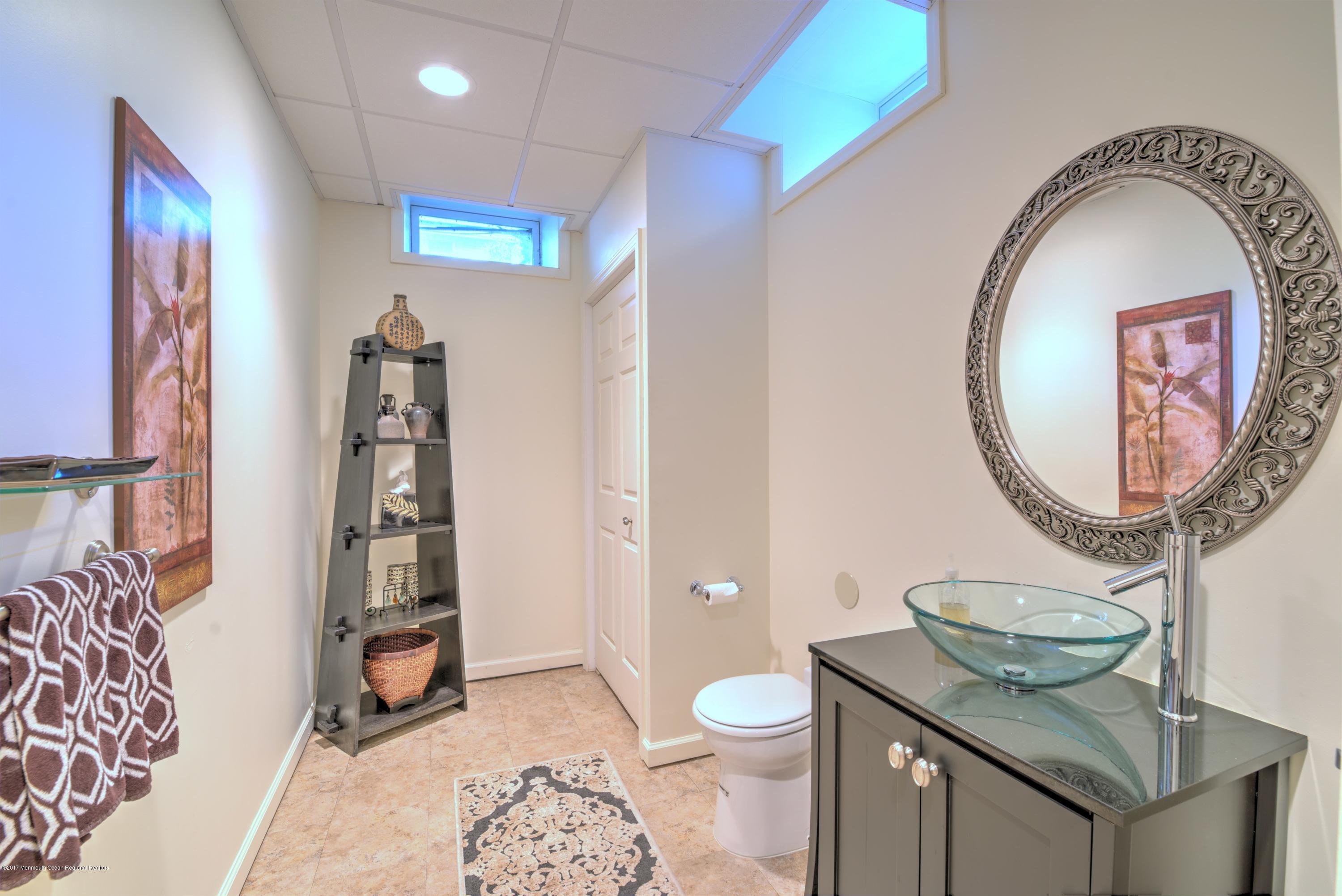 136 Millhurst Road Manalapan, NJ 07726 - Photo 38 of 44 038_LOWER LEVEL POWDER ROOM